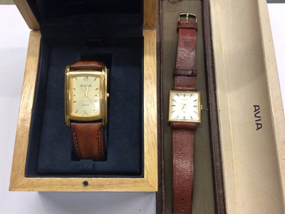 Lot 866 - Two Avia gold plated stainless steel wristwatches on brown leather straps, boxed
