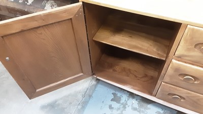 Lot 1065 - Good quality Blonde Ercol Windsor 455 sideboard with three central drawers flanked by cupboards, 154.5cm wide, 43cm deep, 68cm high