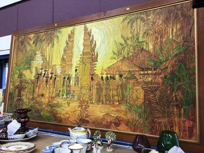 Lot 78 - Very large painting on canvas, possibly Indonesian, signed lower right, depicting a scene of figures making offerings at a temple, 214cm x 113cm including frame