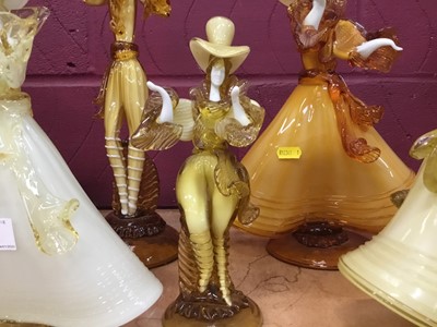 Lot 630 - Eight Murano glass amber coloured  figures