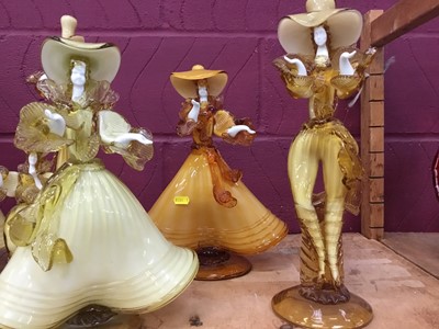Lot 630 - Eight Murano glass amber coloured  figures