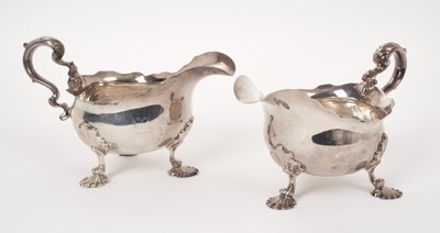 Lot 227 - Near pair of Georgian silver sauce boats