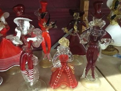 Lot 631 - Fourteen Murano red glass figures 19-37 cm