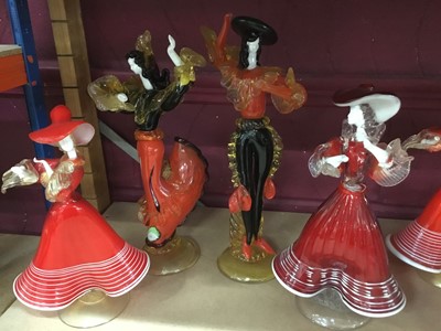 Lot 631 - Fourteen Murano red glass figures 19-37 cm