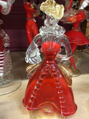 Lot 631 - Fourteen Murano red glass figures 19-37 cm