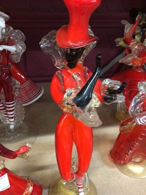 Lot 631 - Fourteen Murano red glass figures 19-37 cm