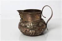Lot 217 - Edwardian Silverer cream jug of compressed...