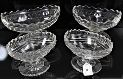Lot 68 - Four 19th century cut glass oval footed dishes with star cut bases, including one pair 17cm wide, and two others