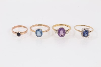 Lot 437 - Four gold and gem-set dress rings