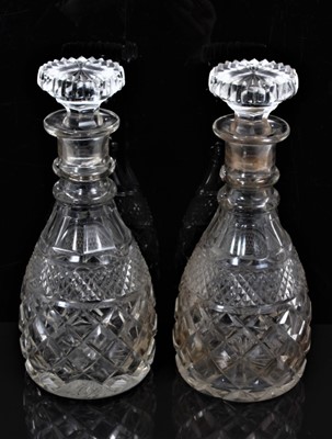 Lot 57 - A pair of 19th century two-ring cut glass decanters with mushroom stoppers, 28cm high