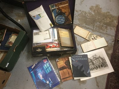 Lot 403 - A vintage leather suitcase containing mixed ephemera including military and cigarette cards