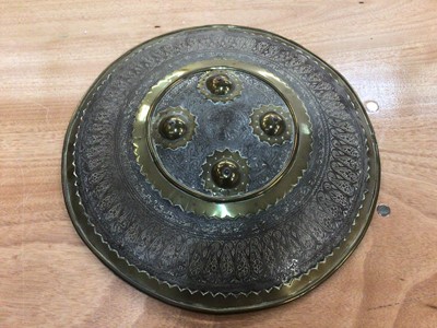 Lot 62 - 19th century Islamic brass shield with engraved decoration, leather handle, 36.5cm diameter