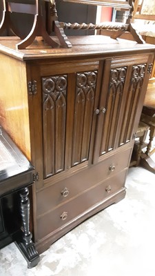Lot 1071 - Oak bedroom suite with linenfold decoration comprising two double wardrobes and a tallboy (3)