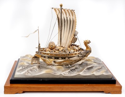 Lot 384 - Japanese Takehiko Seki silver treasure ship on silver plated wave base, bearing signature to rudder