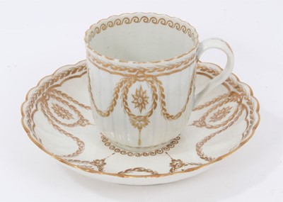 Lot 295 - A Worcester fluted gilt decorated coffee cup and saucer, circa 1775