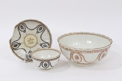 Lot 296 - A Worcester gilt decorated fluted round bowl, circa 1775, and a similar Worcester tea bowl and saucer