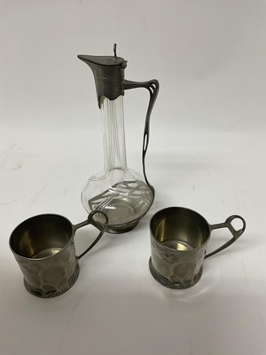 Lot 145 - Art Nouveau pewter mounted decanter and two German pewter cups