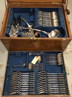 Lot 597 - Part set of silver plated  Fiddle, shell and thread cutlery in an oak canteen.