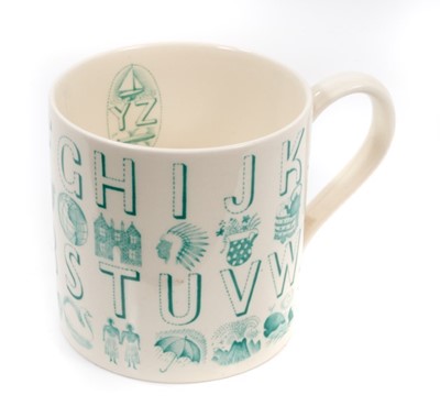 Lot 123 - Eric Ravilious for Wedgwood, an alphabet mug in green on a cream ground, 8.5cm high