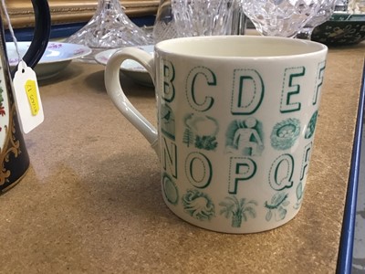 Lot 123 - Eric Ravilious for Wedgwood, an alphabet mug in green on a cream ground, 8.5cm high
