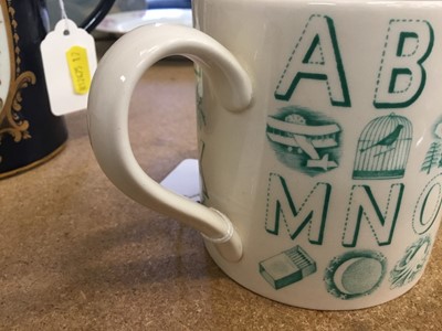 Lot 123 - Eric Ravilious for Wedgwood, an alphabet mug in green on a cream ground, 8.5cm high
