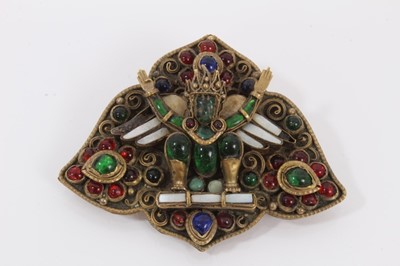 Lot 491 - Antique Indian brooch, believed to represent Garuda, probably Newar People, Kathmandu Valley, Nepal. The multi coloured glass gem stones in gilded brass setting. 53mm x 65mm.