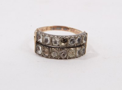 Lot 409 - George III gold and paste ring with two rows of paste stones in closed-back silver collet setting on bifurcated gold shoulders on reeded gold shank. Ring size L½.