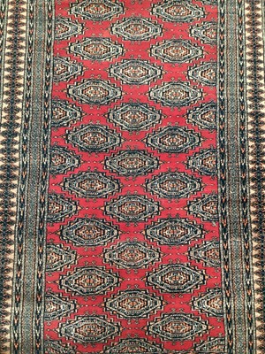 Lot 1517 - Pakistani Bokhara rug and a pair of Indo Persian rugs (3)