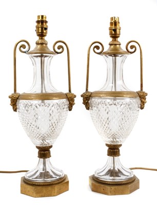 Lot 778 - Pair of good quality cut glass and brass mounted urn shaped table lamps, purchased from Harrods.