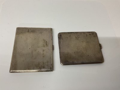 Lot 14 - George V silver cigarette case of rectangular form with engine turned decoration and gilded interior, (Birmingham 1930), maker William Neale Ltd, 10.5cm in overall length, together with another sim...