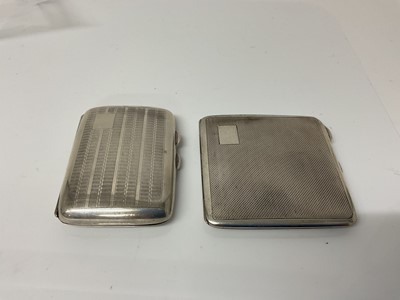 Lot 15 - George V silver cigarette case of rectangular form with engine turned decoration and gilded interior, (Birmingham 1935), maker Mayes, Mills & Co, 8cm in overall length, together with another simila...