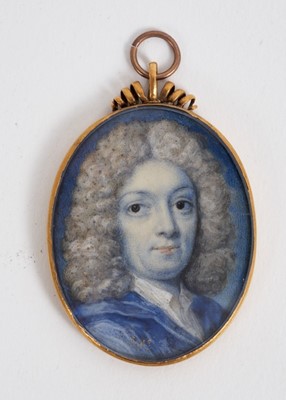 Lot 819 - English School, early 18th century, watercolour miniature portrait on ivory, a gentleman with powdered wig and blue jacket, engraved to reverse 'Aet 32: 1705' sitters initials in cypher, oval 4.2 x...