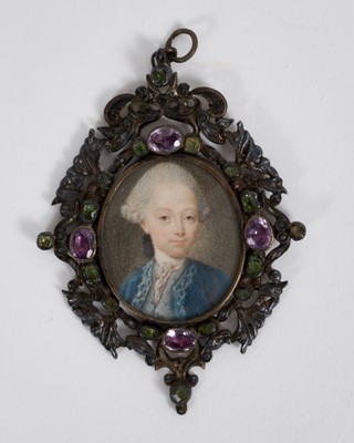 Lot 821 - Continental School, circa 1740, watercolour miniature portrait on ivory, a young gentleman with powdered wig and blue coat, apparently unsigned, 3.5 x 3.2cm, in ornate pierced silver and jewel stud...