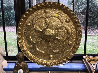 Lot 56 - Eastern brass charger with animal and figural decoration.