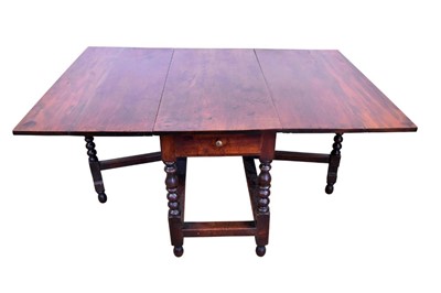 Lot 1325 - Large early 18th century walnut  drop leaf dining table