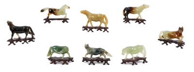 Lot 855 - Set of eight early 20th century Chinese jade horses, with purchase receipt from a Singapore Antique shop dated 1960 and a 1965 insurance valuation.