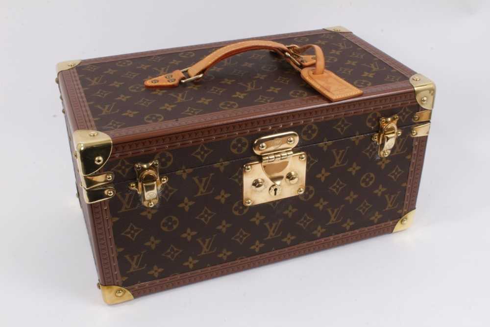 Lot 2089 - Louis Vuitton vanity case with fitted interior, signature monogrammed and brass fittings, together with a Louis Vuitton purse and Louis Vuitton key fob with two keys, label numbered 1029952, lock a...