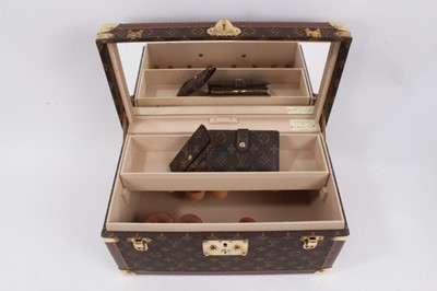 Lot 2089 - Louis Vuitton vanity case with fitted interior, signature monogrammed and brass fittings, together with a Louis Vuitton purse and Louis Vuitton key fob with two keys, label numbered 1029952, lock a...