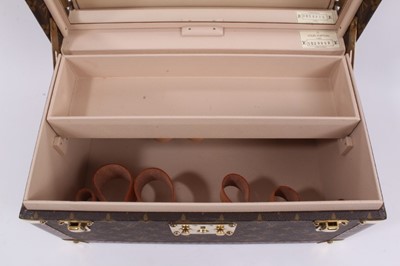 Lot 2089 - Louis Vuitton vanity case with fitted interior, signature monogrammed and brass fittings, together with a Louis Vuitton purse and Louis Vuitton key fob with two keys, label numbered 1029952, lock a...