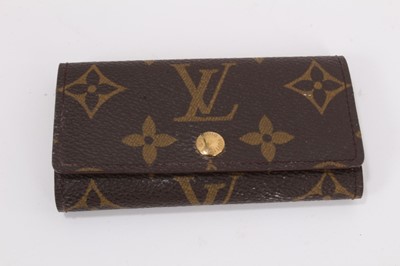 Lot 2089 - Louis Vuitton vanity case with fitted interior, signature monogrammed and brass fittings, together with a Louis Vuitton purse and Louis Vuitton key fob with two keys, label numbered 1029952, lock a...