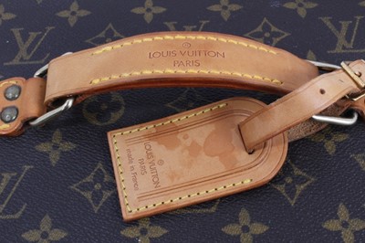 Lot 2089 - Louis Vuitton vanity case with fitted interior, signature monogrammed and brass fittings, together with a Louis Vuitton purse and Louis Vuitton key fob with two keys, label numbered 1029952, lock a...