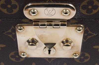 Lot 2089 - Louis Vuitton vanity case with fitted interior, signature monogrammed and brass fittings, together with a Louis Vuitton purse and Louis Vuitton key fob with two keys, label numbered 1029952, lock a...