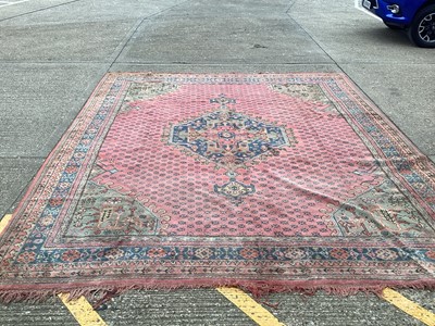 Lot 1159 - Large Turkey pattern rug with central medallion on red, blue and green ground, 408cm x 343cm