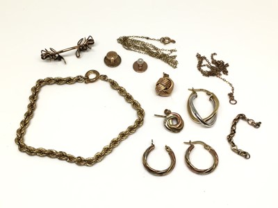 Lot 29 - Five 9ct gold earrings, yellow metal rope twist bracelet, two yellow metal studs, three pieces of yellow metal chains and gold plated glasses bridge piece