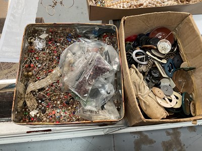 Lot 546 - Two boxes of miscellaneous beads, buckles and buttons.