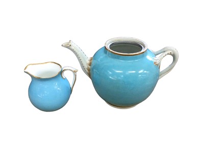 Lot 213 - A Worcester turquoise ground teapot, circa 1770, and a turquoise ground small cream jug