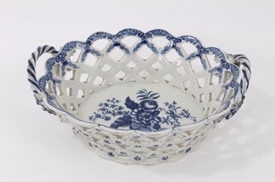 Lot 9 - 18th century Caughley porcelain blue and white chestnut basket decorated in the Pinecone pattern, with reticulated basket weave and applied handles and flowers.