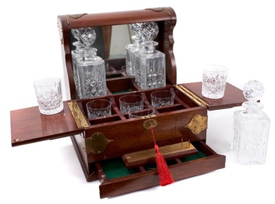 Lot 711 - Early 20th century mahogany and brass bound tantalus