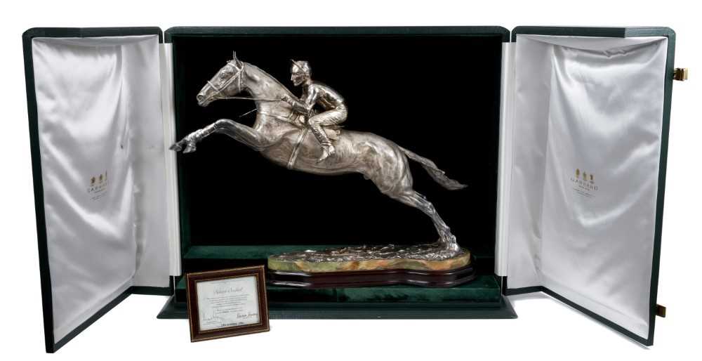 Lot 900 - A fine and highly impressive silver sculpture of Desert Orchid with Simon Sherwood up, realistically modelled rising for a jump