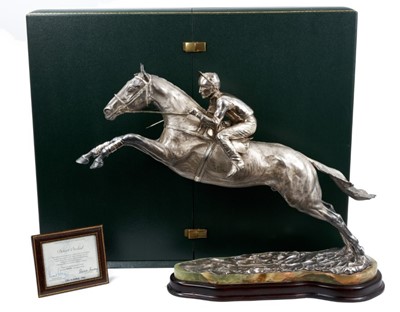Lot 900 - A fine and highly impressive silver sculpture of Desert Orchid with Simon Sherwood up, realistically modelled rising for a jump
